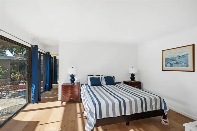 a bedroom with double bed and a large mirror