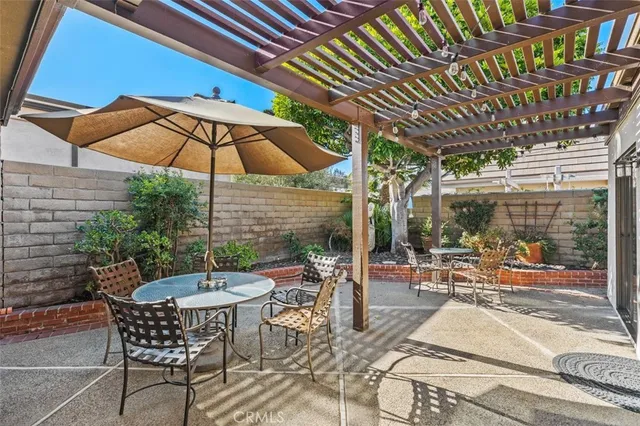 a patio with a patio table and chairs