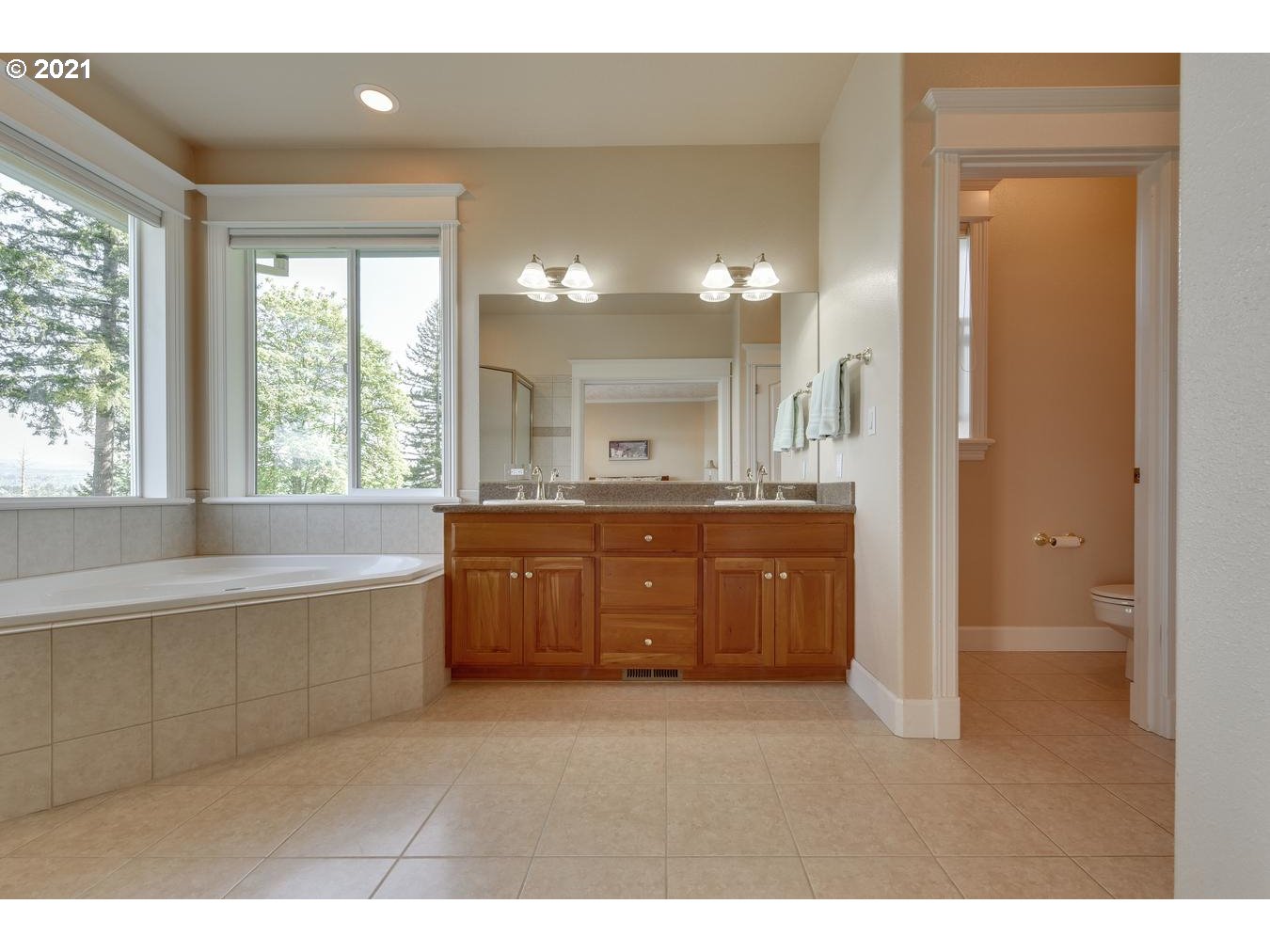 38636 Southeast Hudson Road Sandy, OR 97055 - Photo 16 of 32 a bathroom with a granite countertop tub a sink and a large mirror
