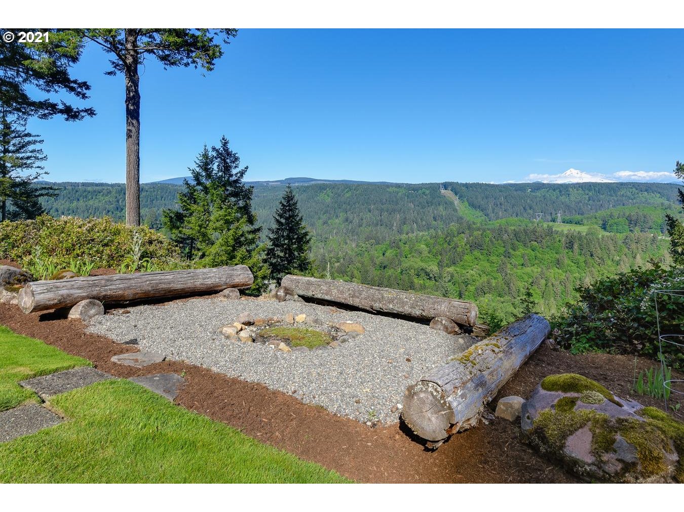 38636 Southeast Hudson Road Sandy, OR 97055 - Photo 23 of 32 a view of a backyard with table and chairs plants and mountain view