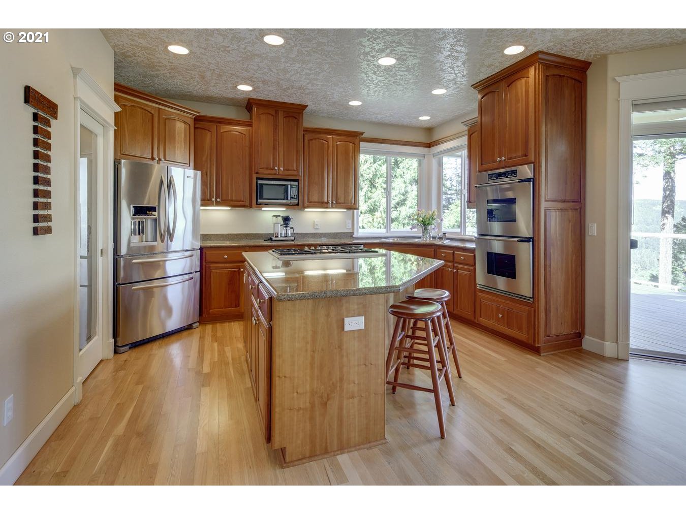 38636 Southeast Hudson Road Sandy, OR 97055 - Photo 8 of 32 a kitchen with stainless steel appliances granite countertop a refrigerator a sink dishwasher a stove and a refrigerator