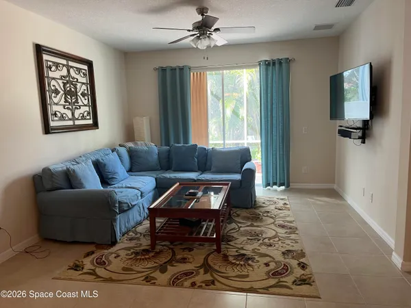 a living room with furniture and a window