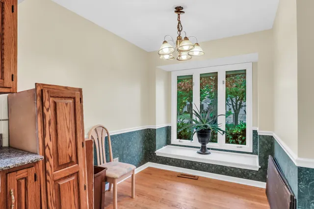 a view of a livingroom with furniture window and wooden floor
