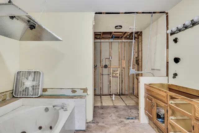 a bathroom with a bathtub and a shower