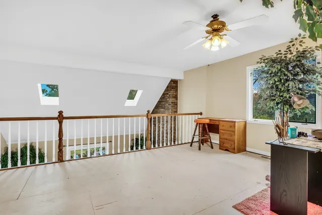 a view of a patio with a table and chairs