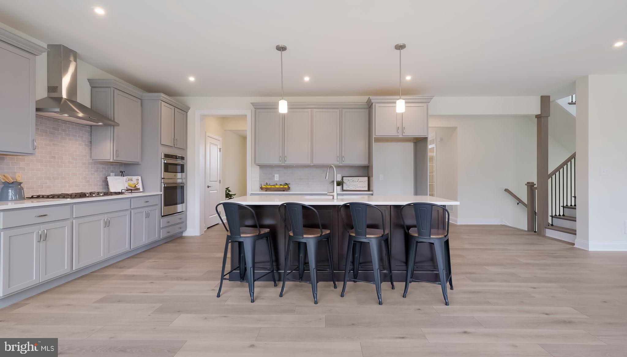 1212 Jordan Lane Perkasie, PA 18944 - Photo 11 of 40 a large kitchen with a table and chairs