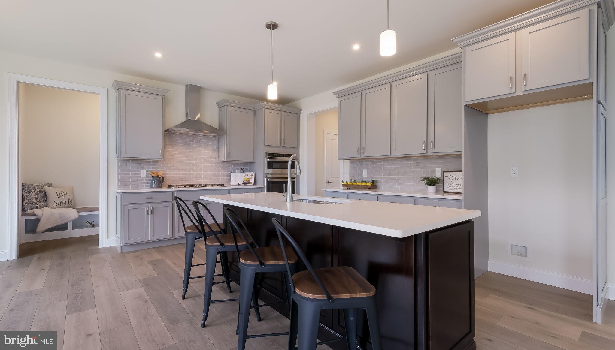 1212 Jordan Lane Perkasie, PA 18944 - Photo 12 of 40 a kitchen with a sink a center island stainless steel appliances and cabinets
