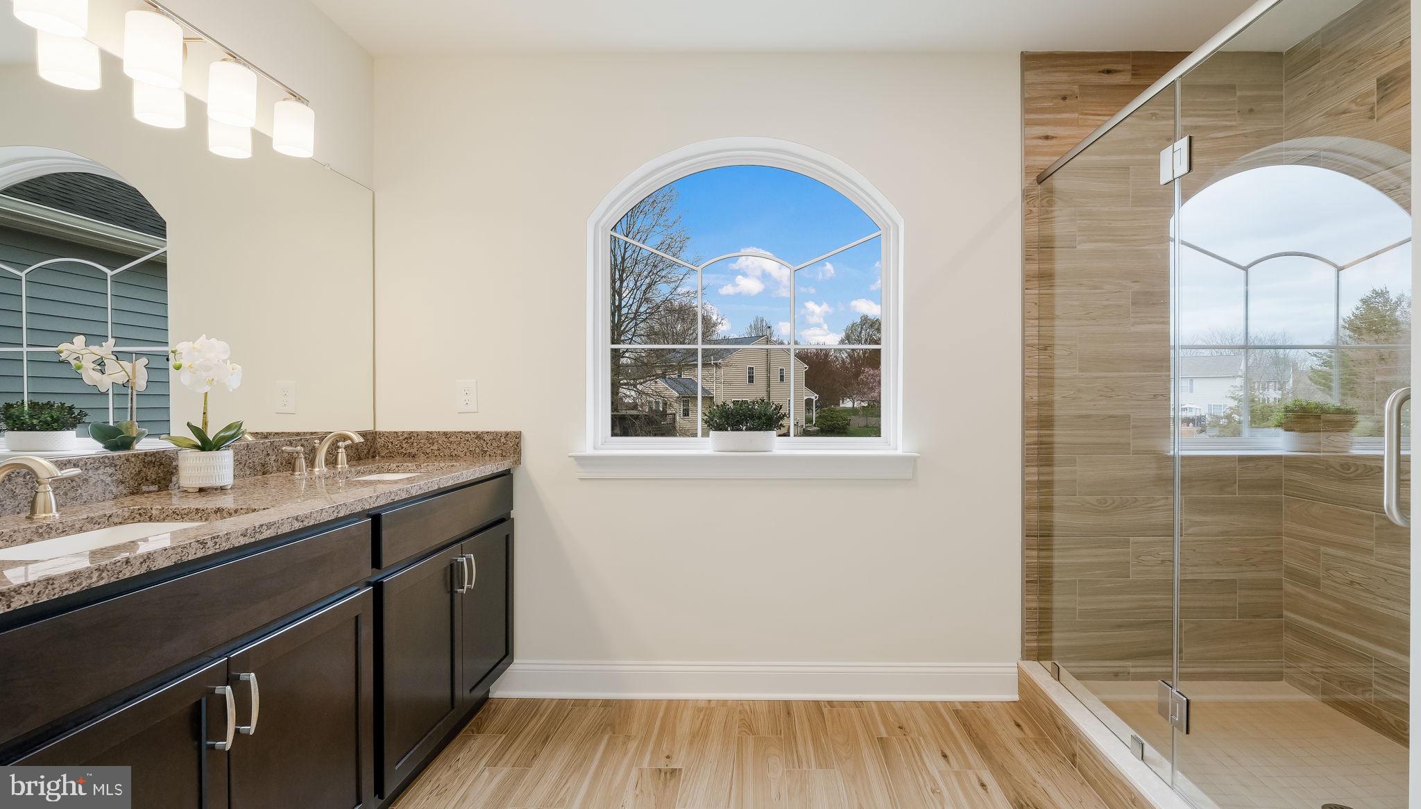 1212 Jordan Lane Perkasie, PA 18944 - Photo 27 of 40 a bathroom with a granite countertop sink mirror and bathtub