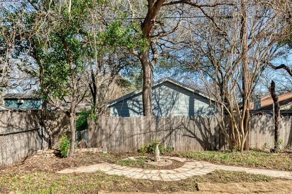 a view of a house with snow on the tree