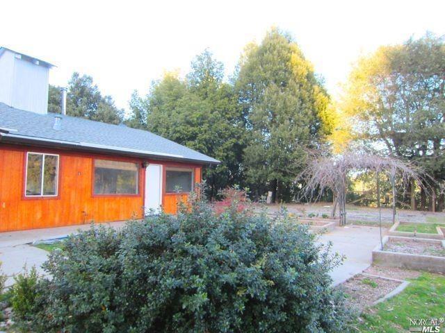 5000 Laytonville Dos Rios Road Laytonville, CA 95454 - Photo 1 of 1 a front view of a house with a yard
