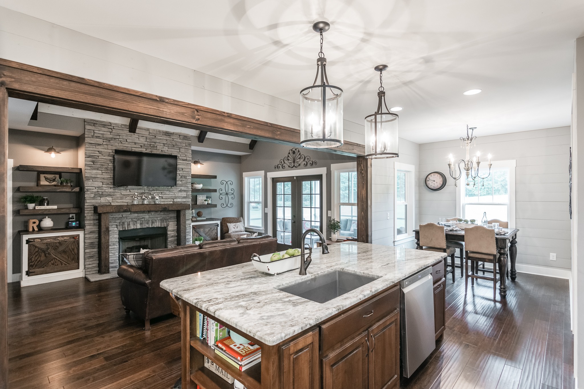 377 Tom Link Road Cottontown, TN 37048 - Photo 12 of 46 a kitchen with a table chairs stove and wooden floor