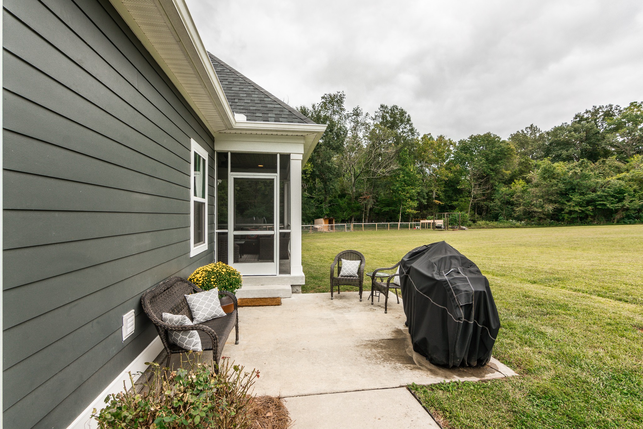 377 Tom Link Road Cottontown, TN 37048 - Photo 32 of 46 a view of a chair and tables in the patio