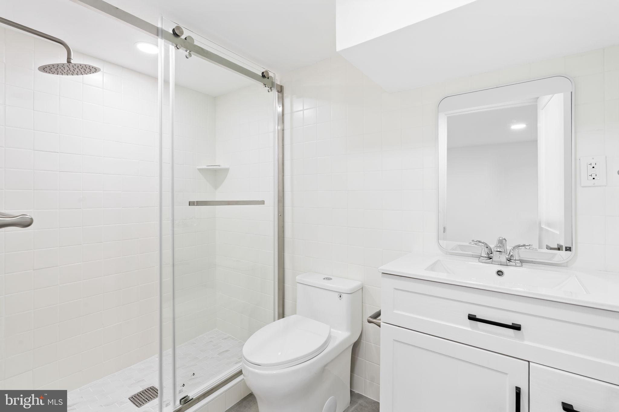 628 South 51st Street Philadelphia, PA 19143 - Photo 17 of 17 a bathroom with a sink a toilet and shower