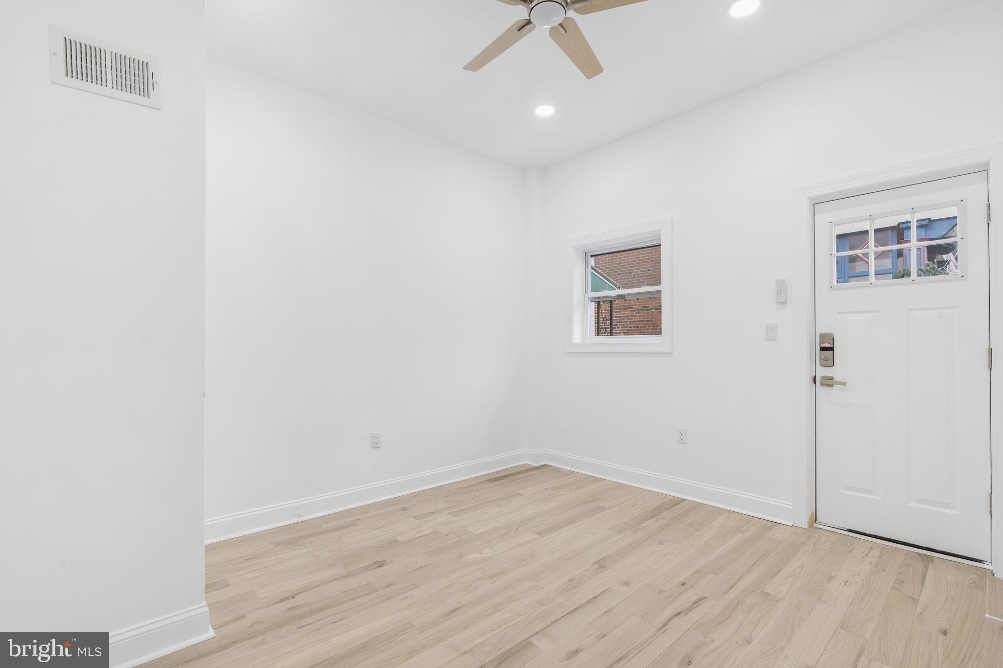 628 South 51st Street Philadelphia, PA 19143 - Photo 6 of 17 an empty room with a window and ceiling fan