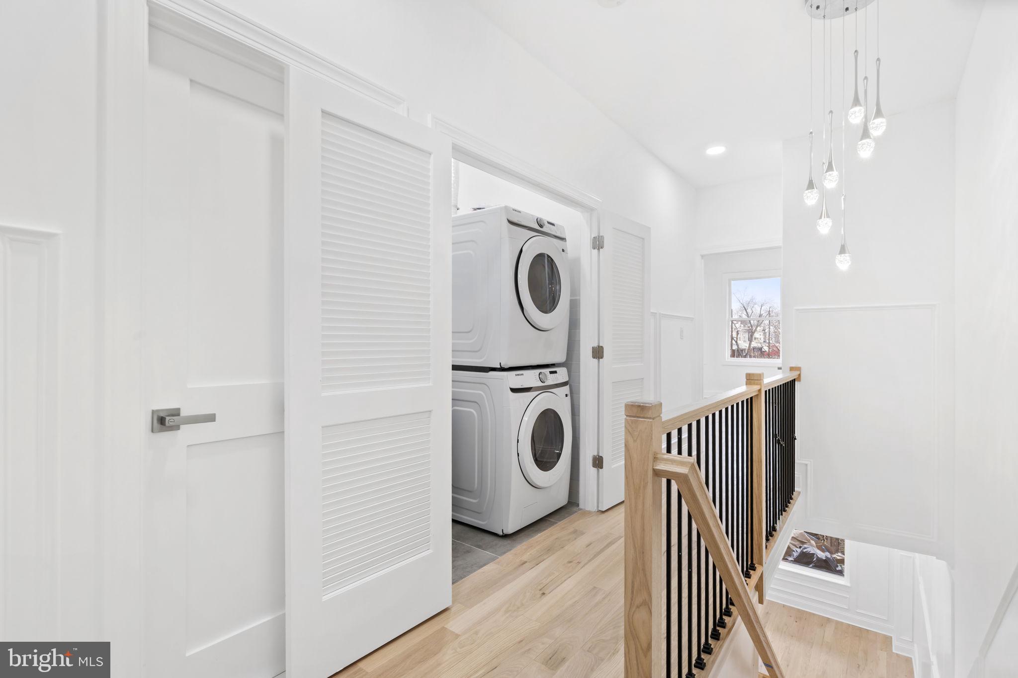 628 South 51st Street Philadelphia, PA 19143 - Photo 10 of 17 a view of a hallway with washer and dryer