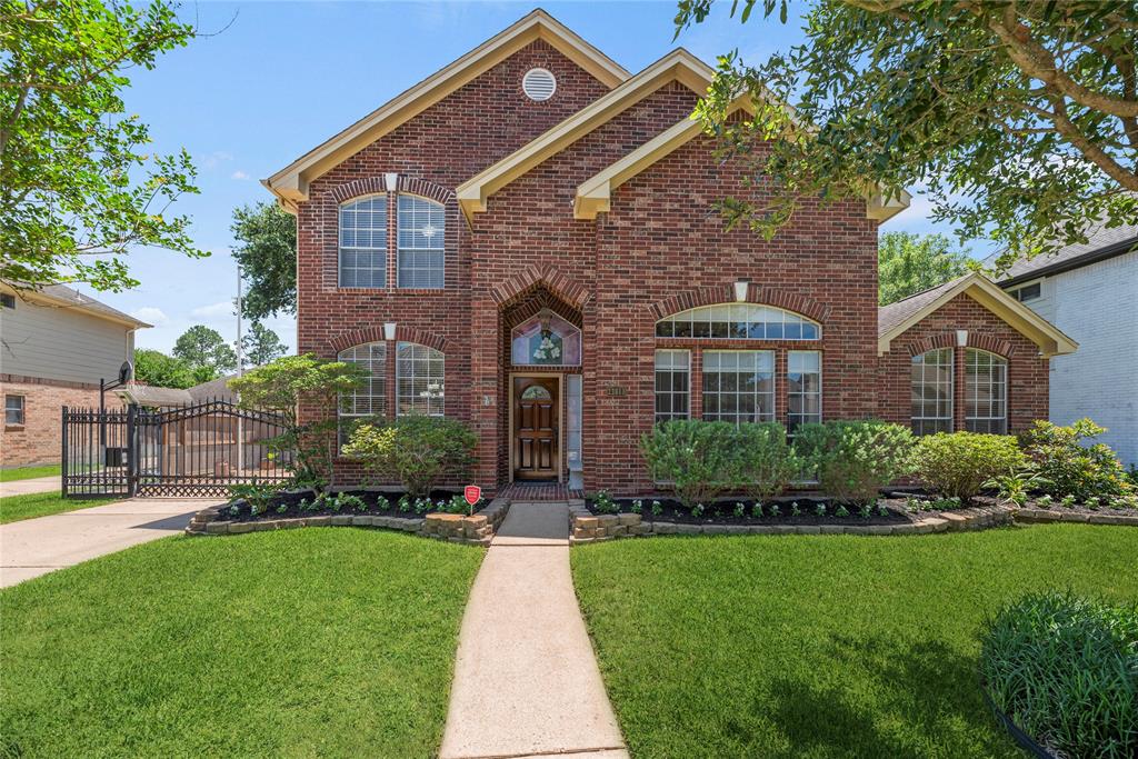 Welcome home to 23011 Heathercroft Drive in the highly sought after Governor's Place community in Katy.