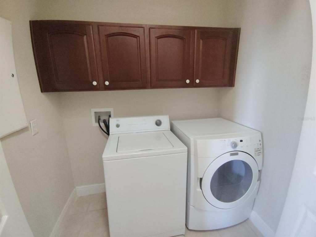 843 Glendora Road Poinciana, FL 34759 - Photo 12 of 15 a utility room with dryer and washer
