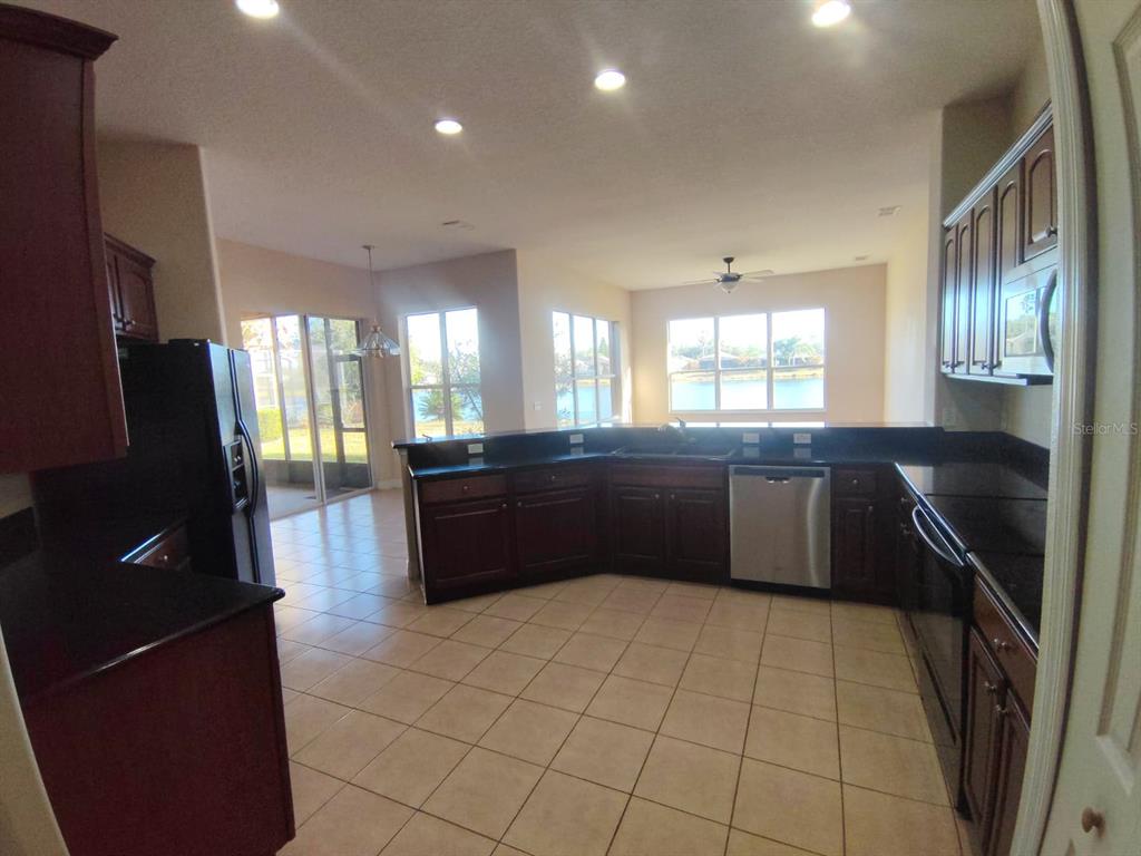 843 Glendora Road Poinciana, FL 34759 - Photo 4 of 15 a large bathroom with a large tub and sink