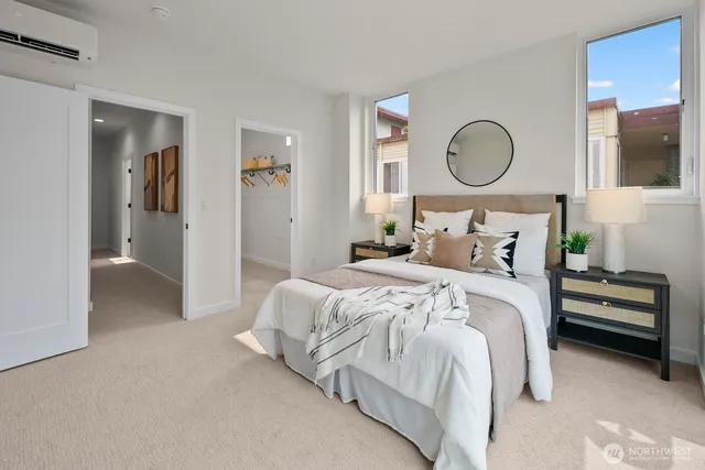 a bedroom with bed and a chandelier