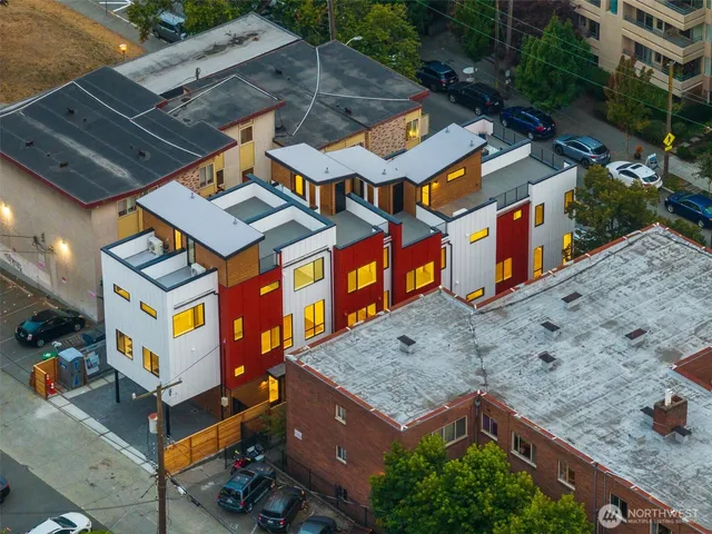 an aerial view of residential houses with outdoor space