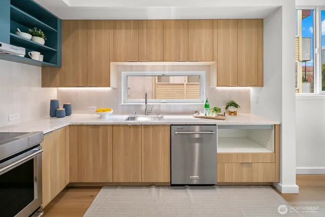 a kitchen with a sink and cabinets