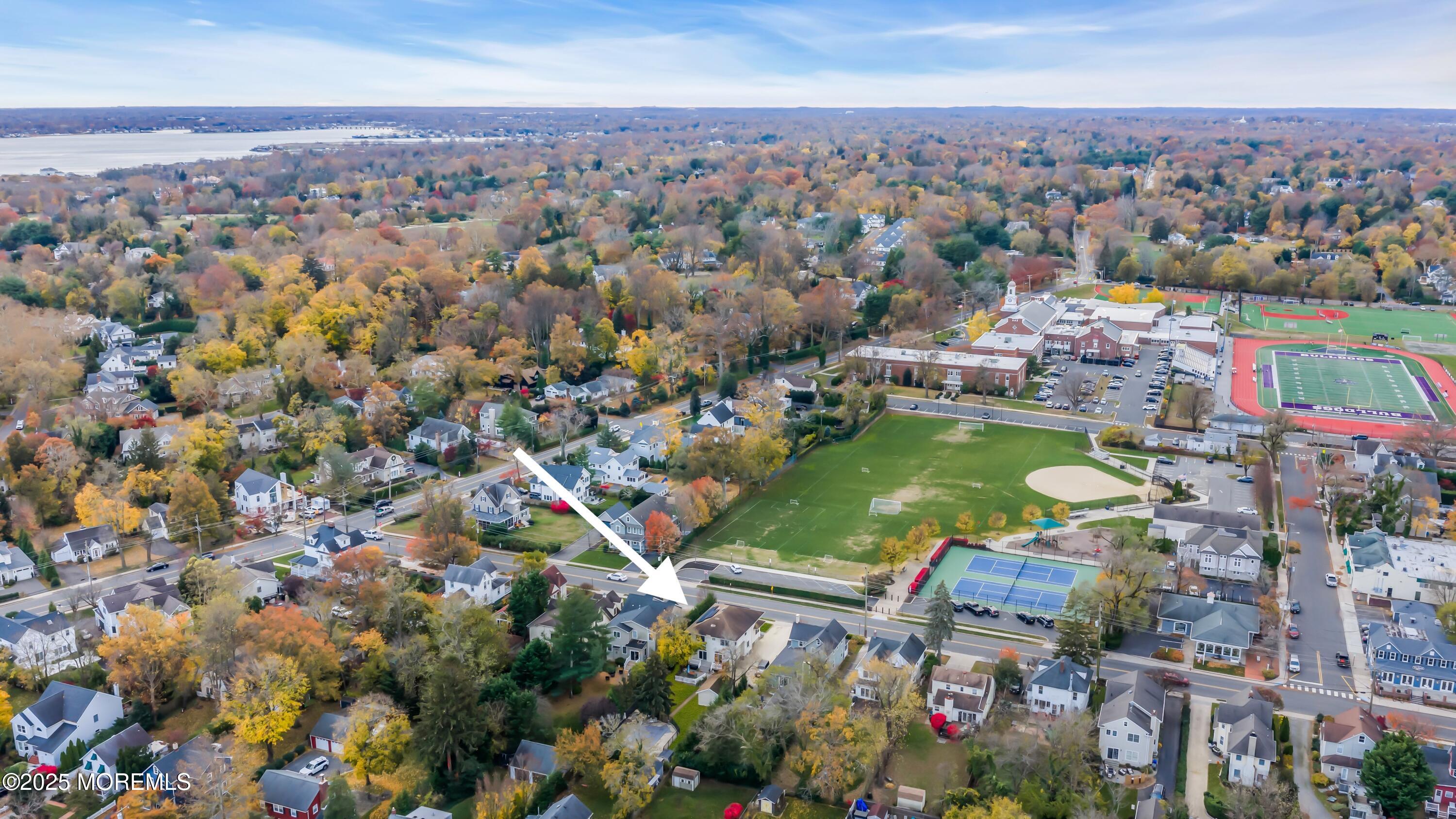 162 East River Road Rumson, NJ 07760 - Photo 12 of 70 an aerial view of residential houses with outdoor space and swimming pool