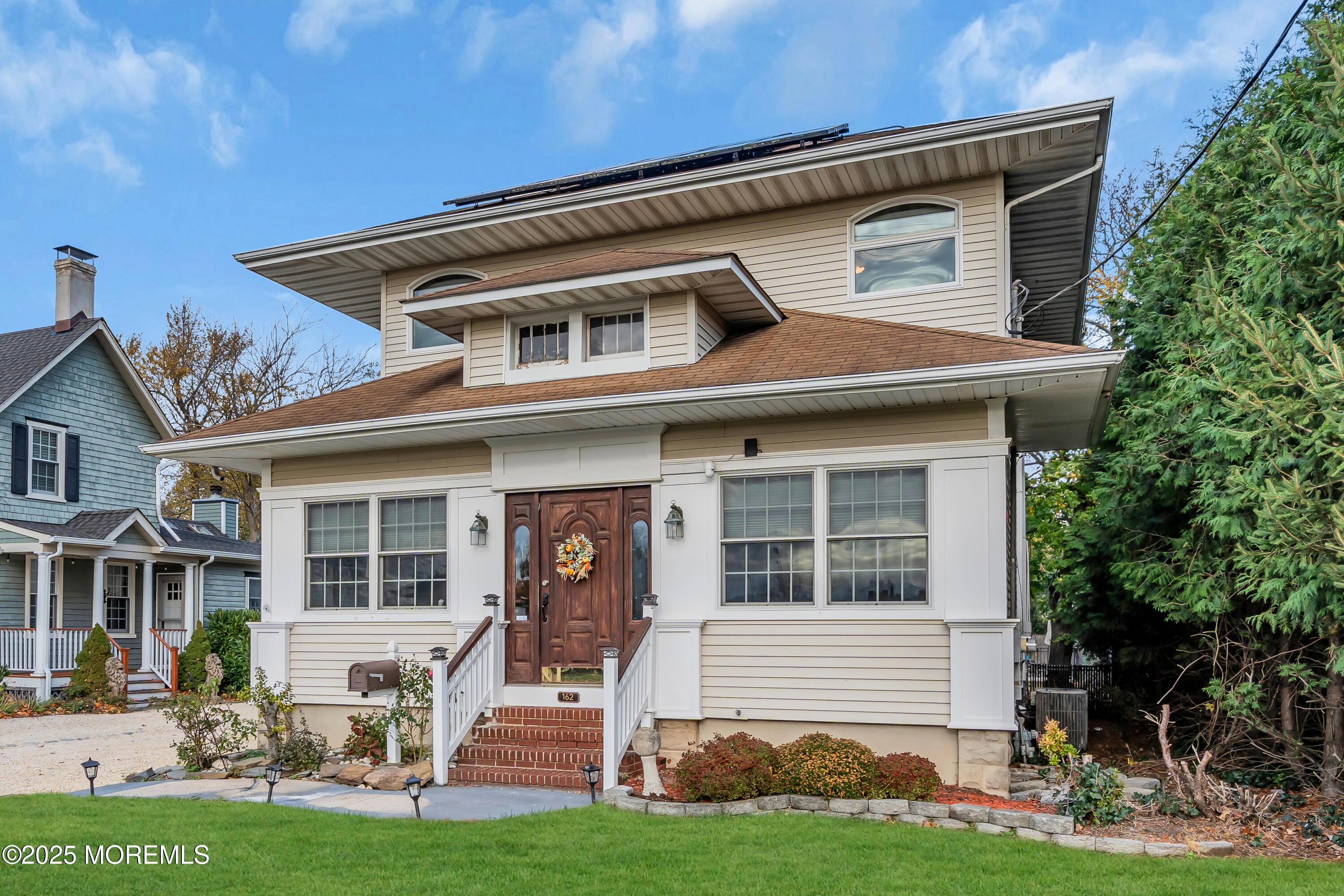 162 East River Road Rumson, NJ 07760 - Photo 2 of 70 a front view of a house with a yard