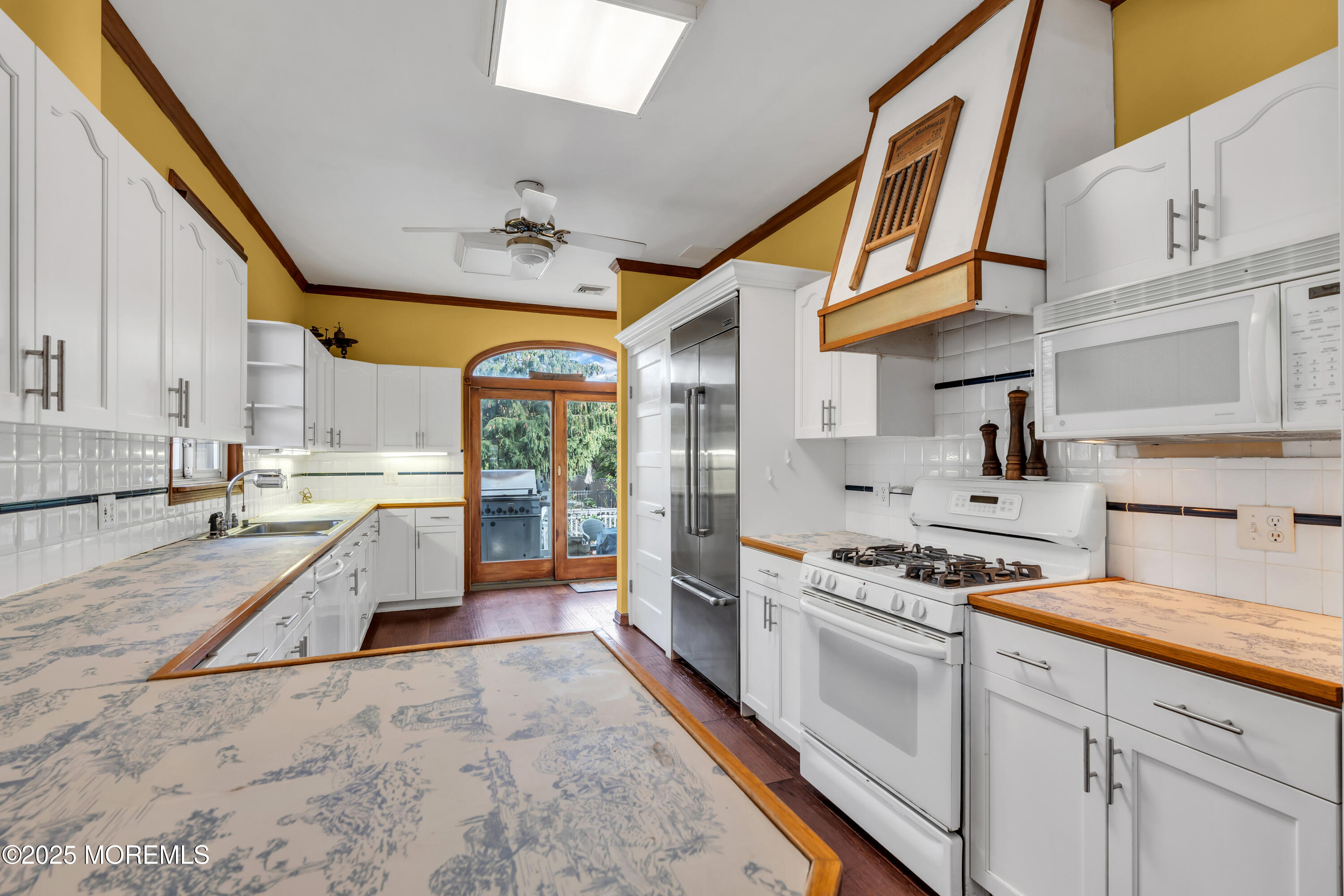 162 East River Road Rumson, NJ 07760 - Photo 22 of 70 a kitchen with stainless steel appliances granite countertop a sink and cabinets