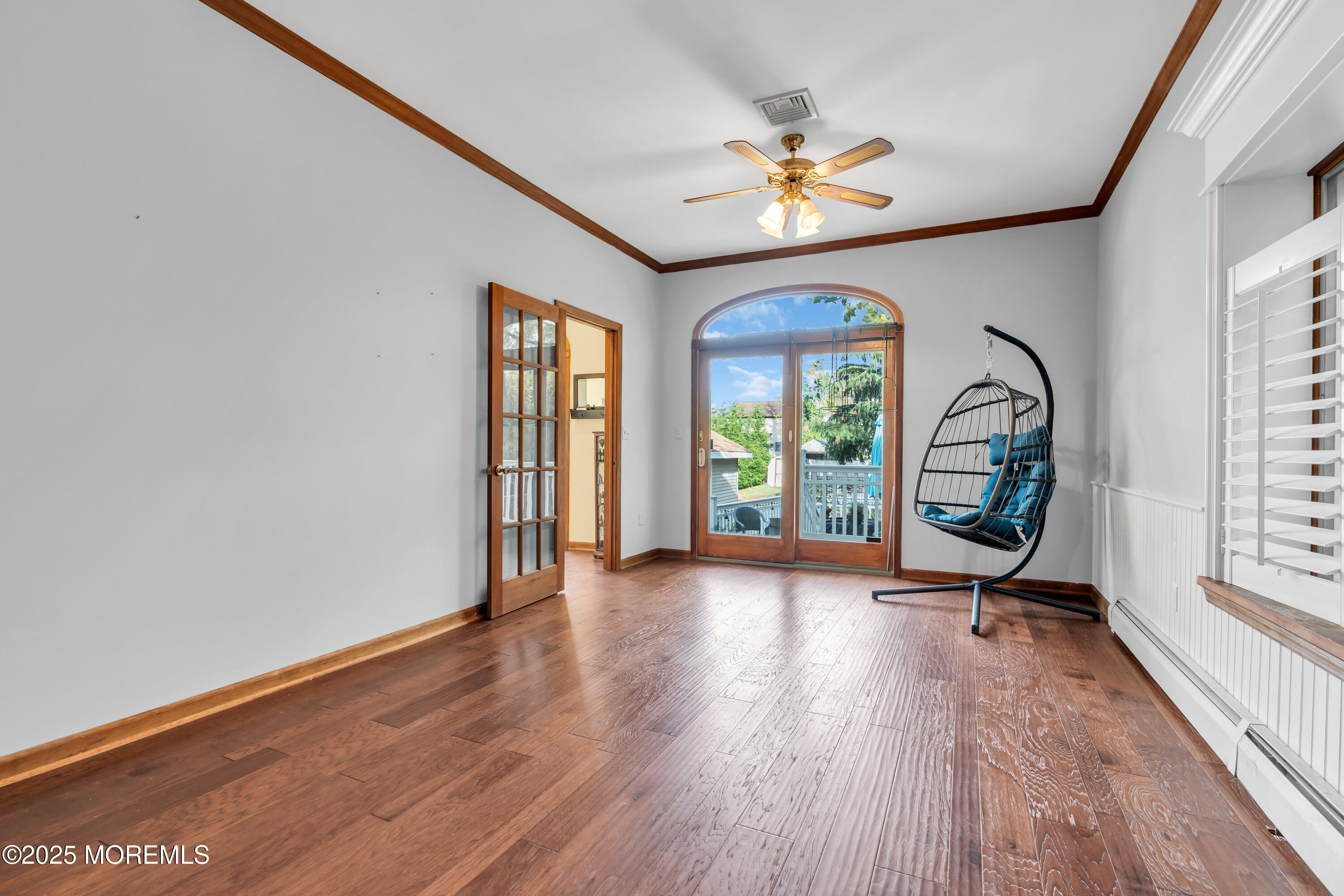 162 East River Road Rumson, NJ 07760 - Photo 26 of 70 a view of a room with window wooden floor and a ceiling fan