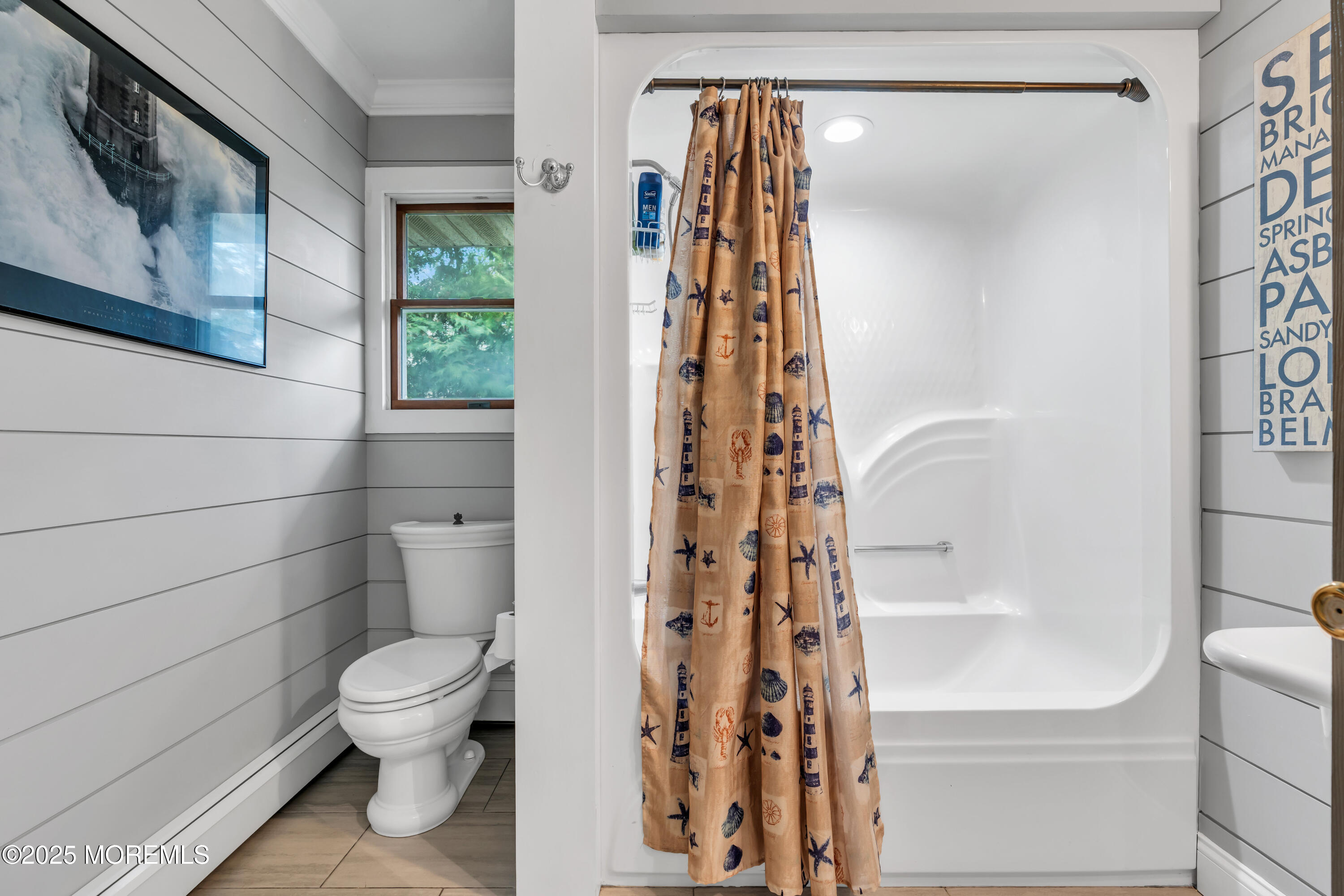 162 East River Road Rumson, NJ 07760 - Photo 30 of 70 a bathroom with a toilet and shower