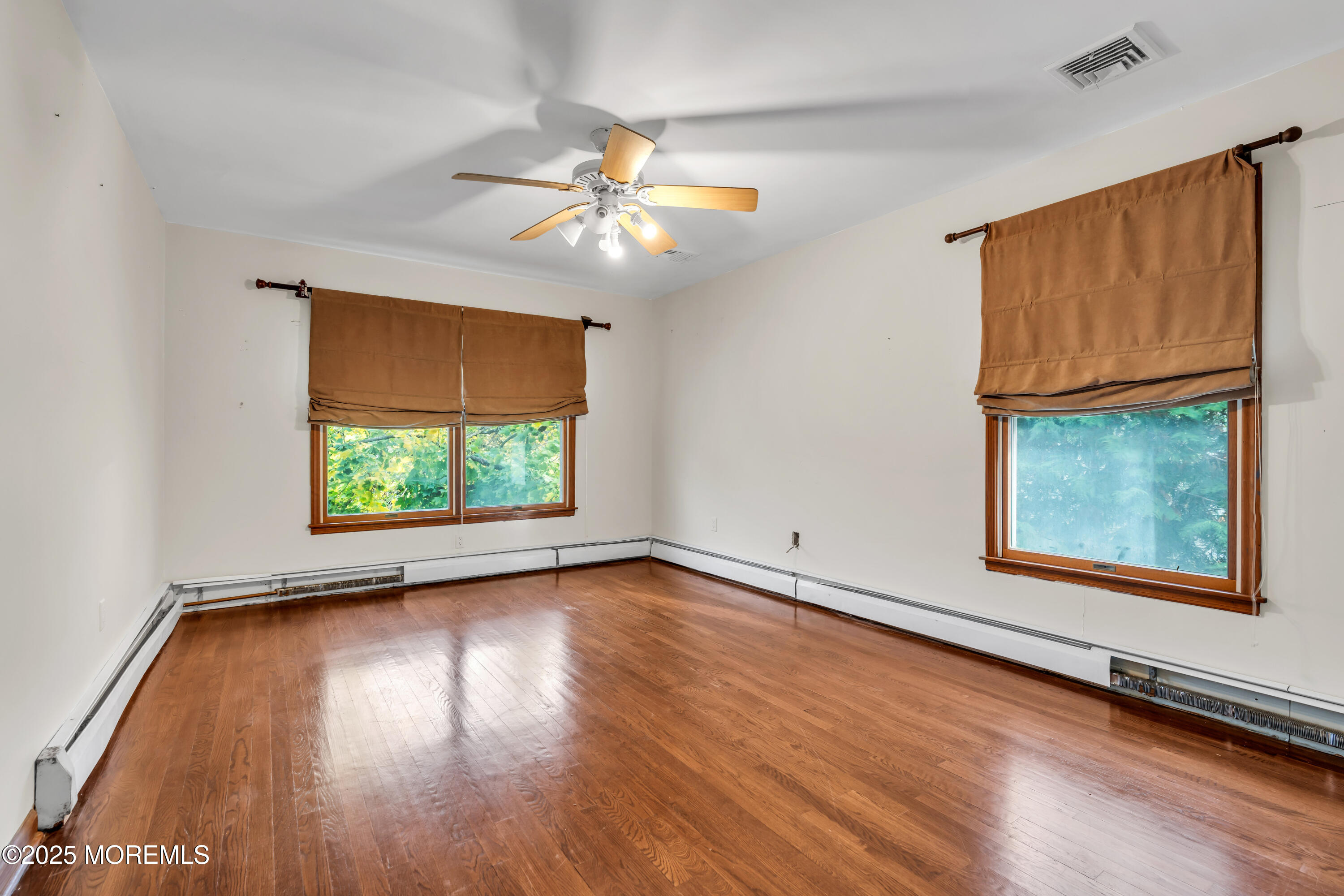 162 East River Road Rumson, NJ 07760 - Photo 33 of 70 a view of an empty room with window and wooden floor
