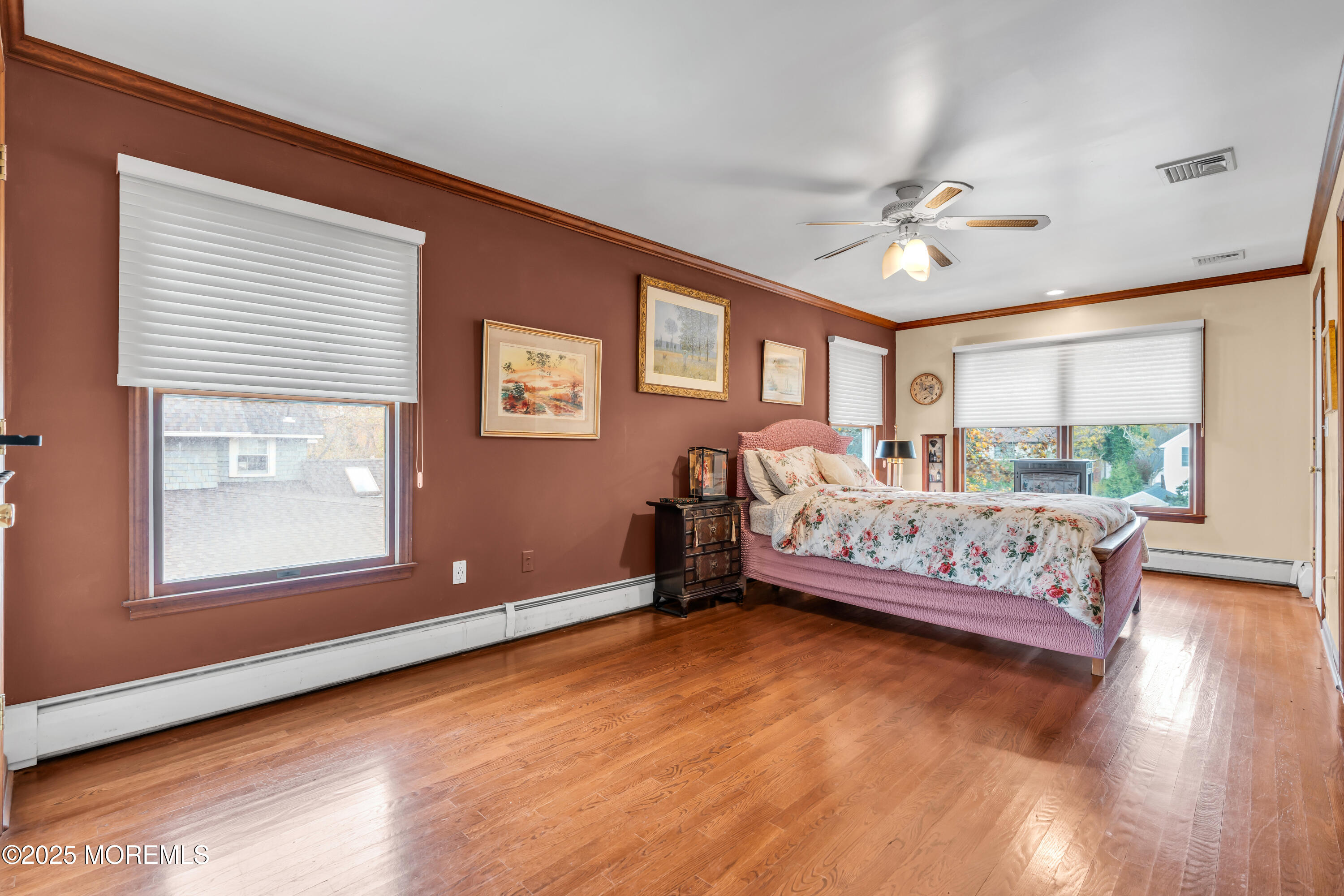 162 East River Road Rumson, NJ 07760 - Photo 36 of 70 a bedroom with a bed chandelier and a window