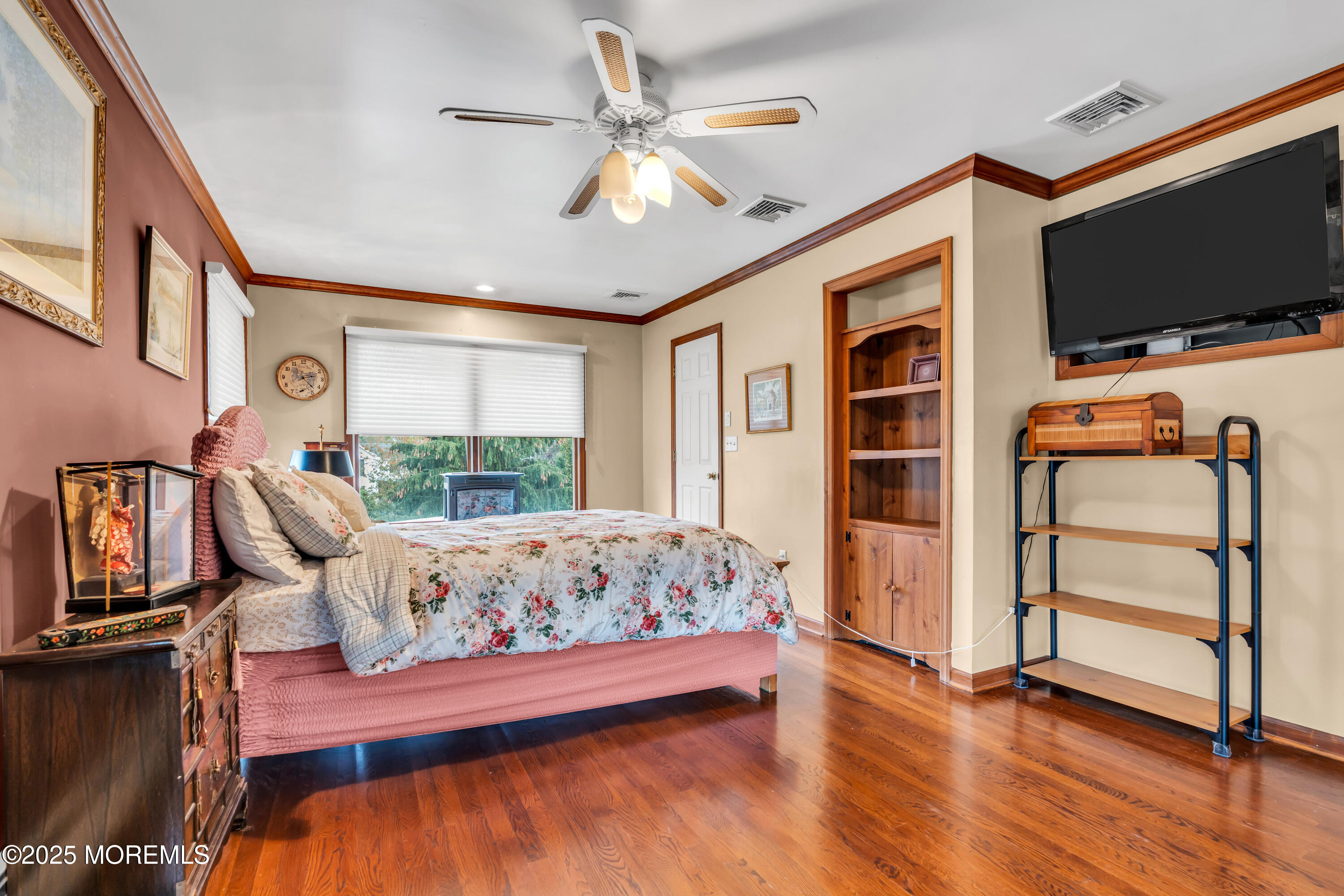 162 East River Road Rumson, NJ 07760 - Photo 37 of 70 a bedroom with furniture and a flat screen tv