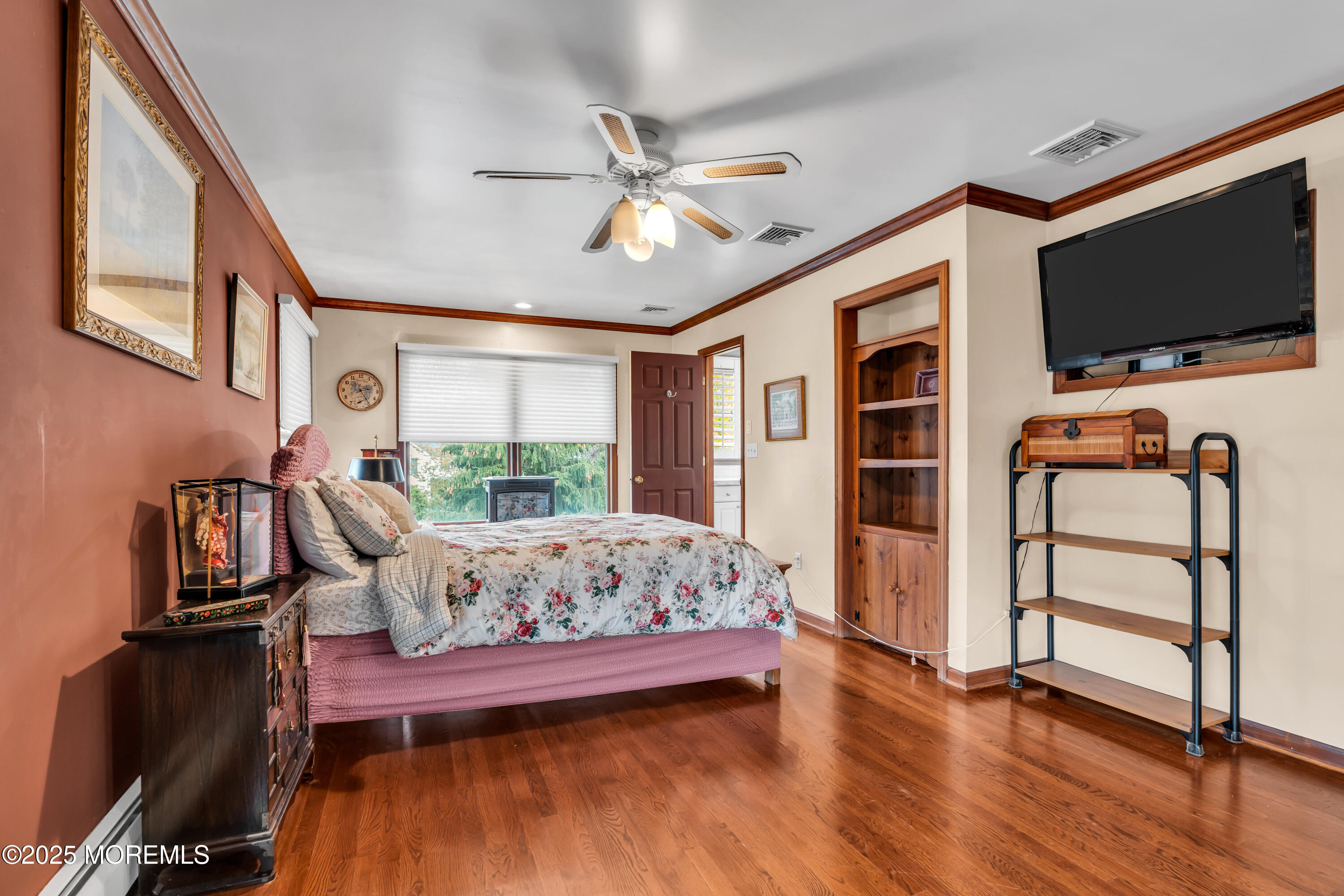 162 East River Road Rumson, NJ 07760 - Photo 39 of 70 a bedroom with furniture and a flat screen tv