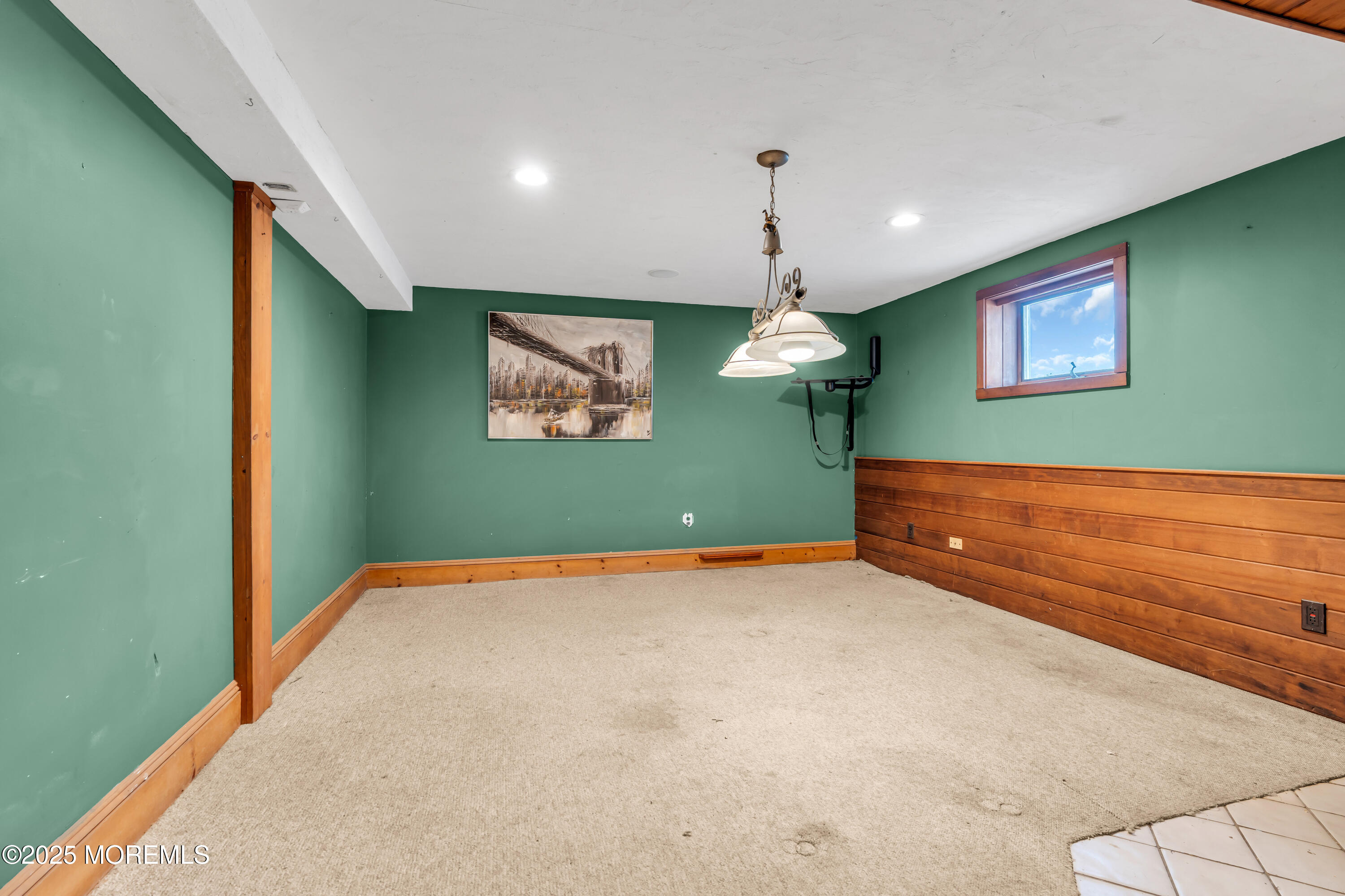 162 East River Road Rumson, NJ 07760 - Photo 40 of 70 a view of an empty room with window and stairs