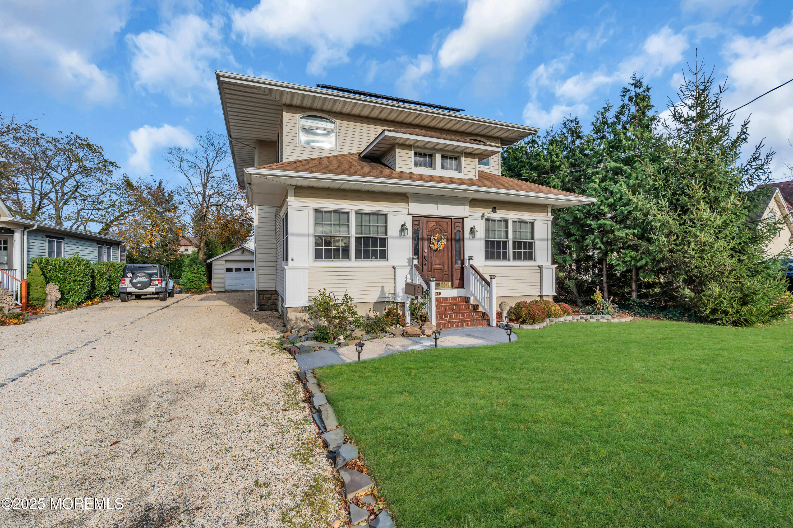 162 East River Road Rumson, NJ 07760 - Photo 46 of 70 a front view of a house with garden