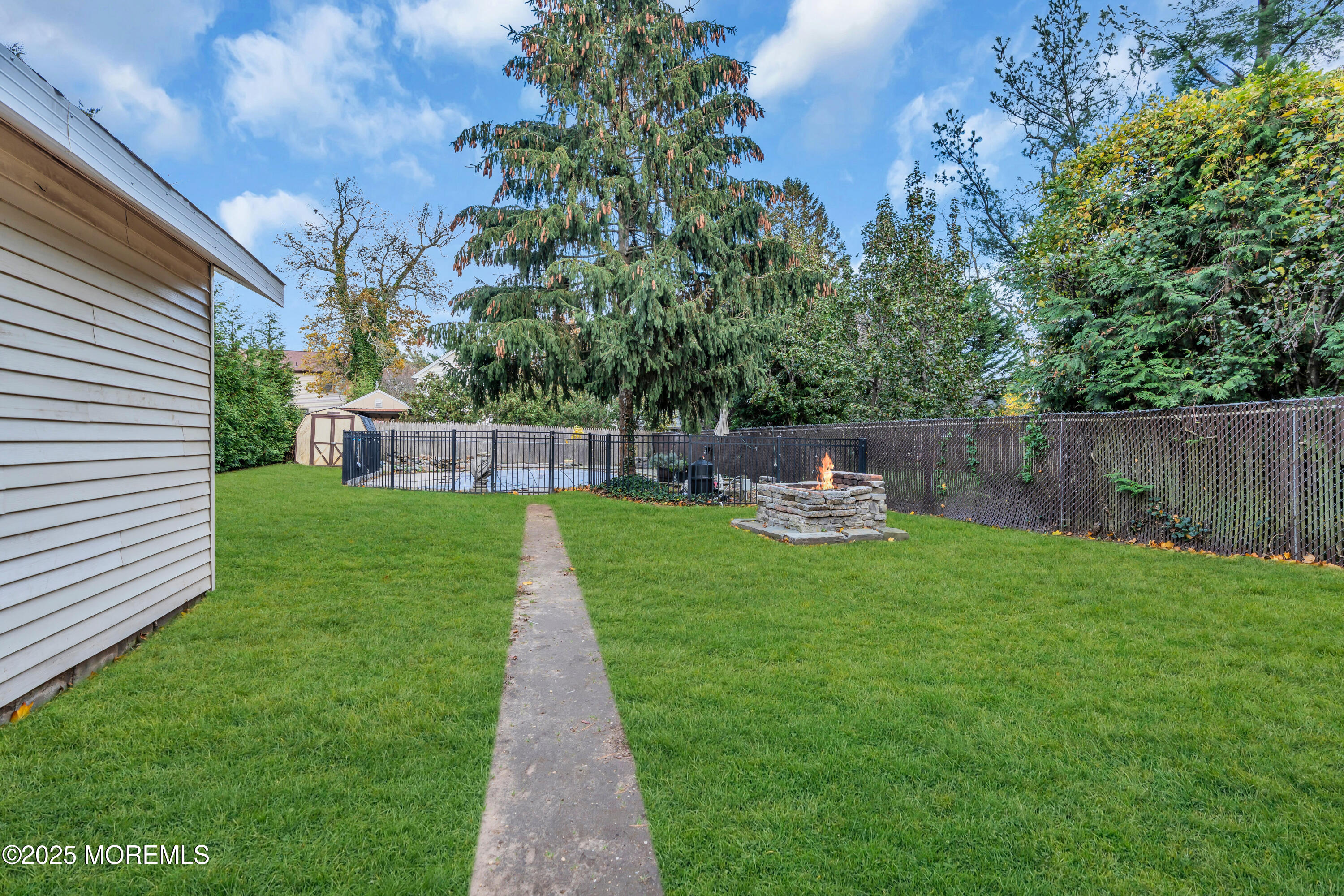 162 East River Road Rumson, NJ 07760 - Photo 56 of 70 a view of a backyard with sitting area