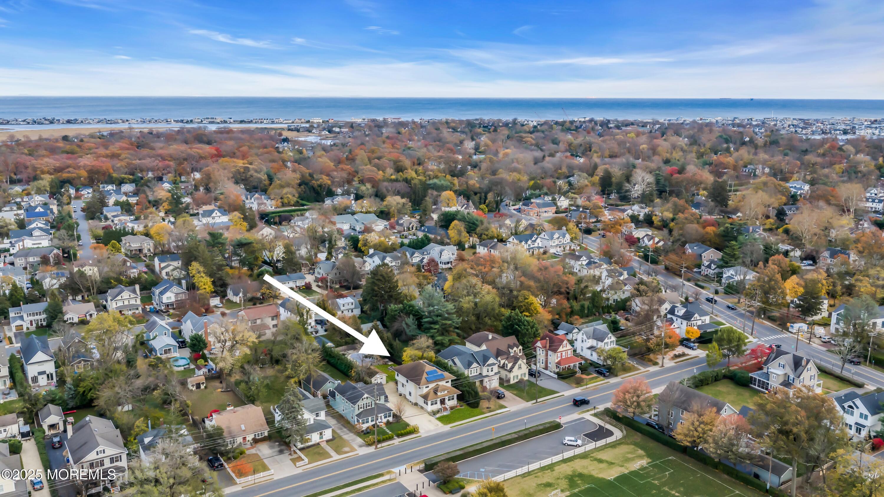 162 East River Road Rumson, NJ 07760 - Photo 9 of 70 an aerial view of residential houses with outdoor space and trees