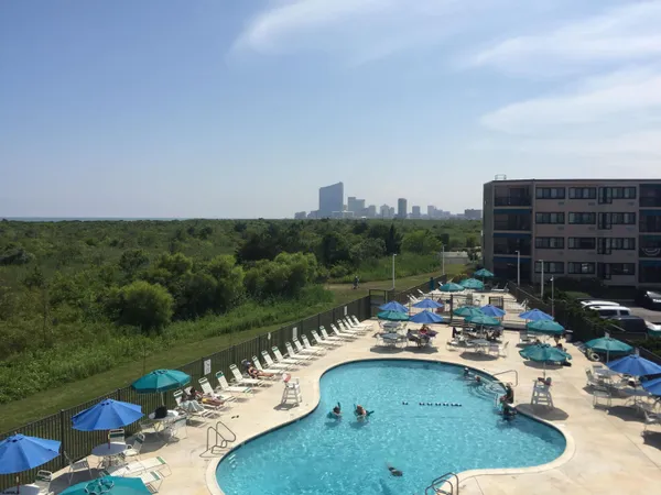 a view of a swimming pool with a patio