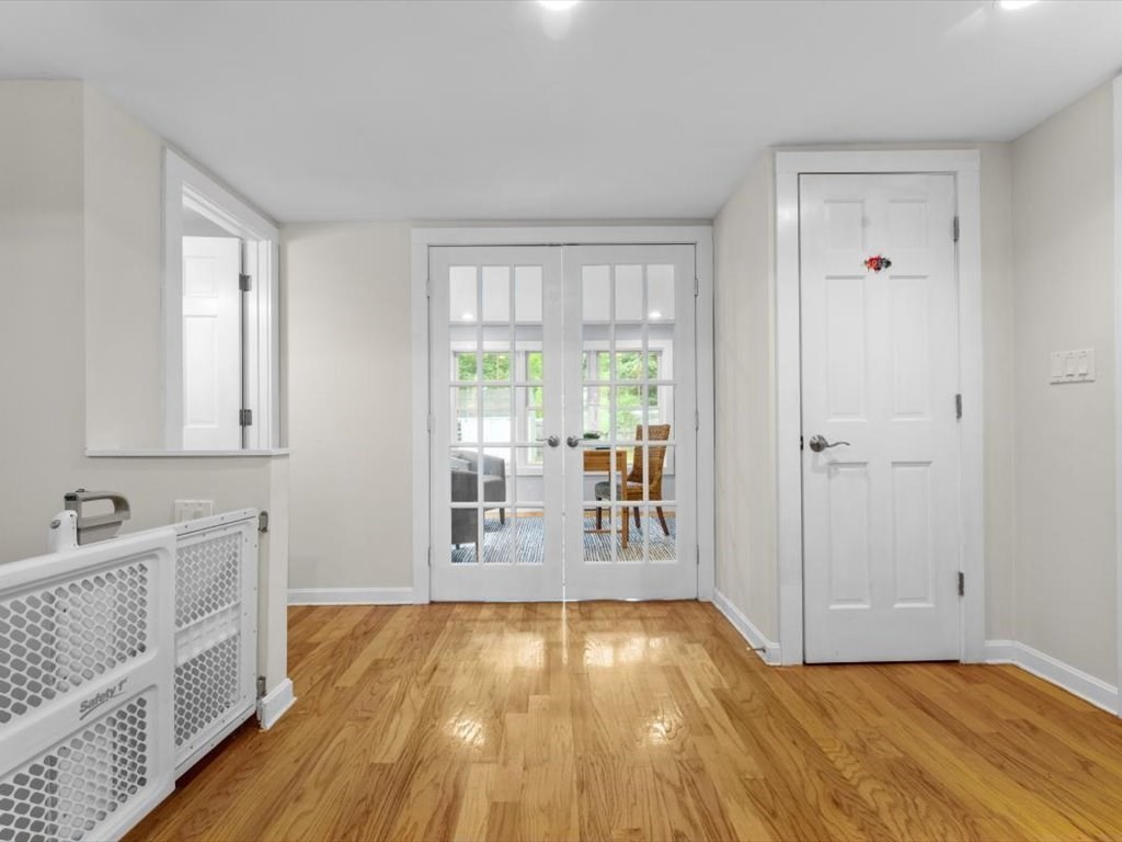 39 Evergreen Road Natick, MA 01760 - Photo 14 of 36 a view of an empty room with window and wooden floor
