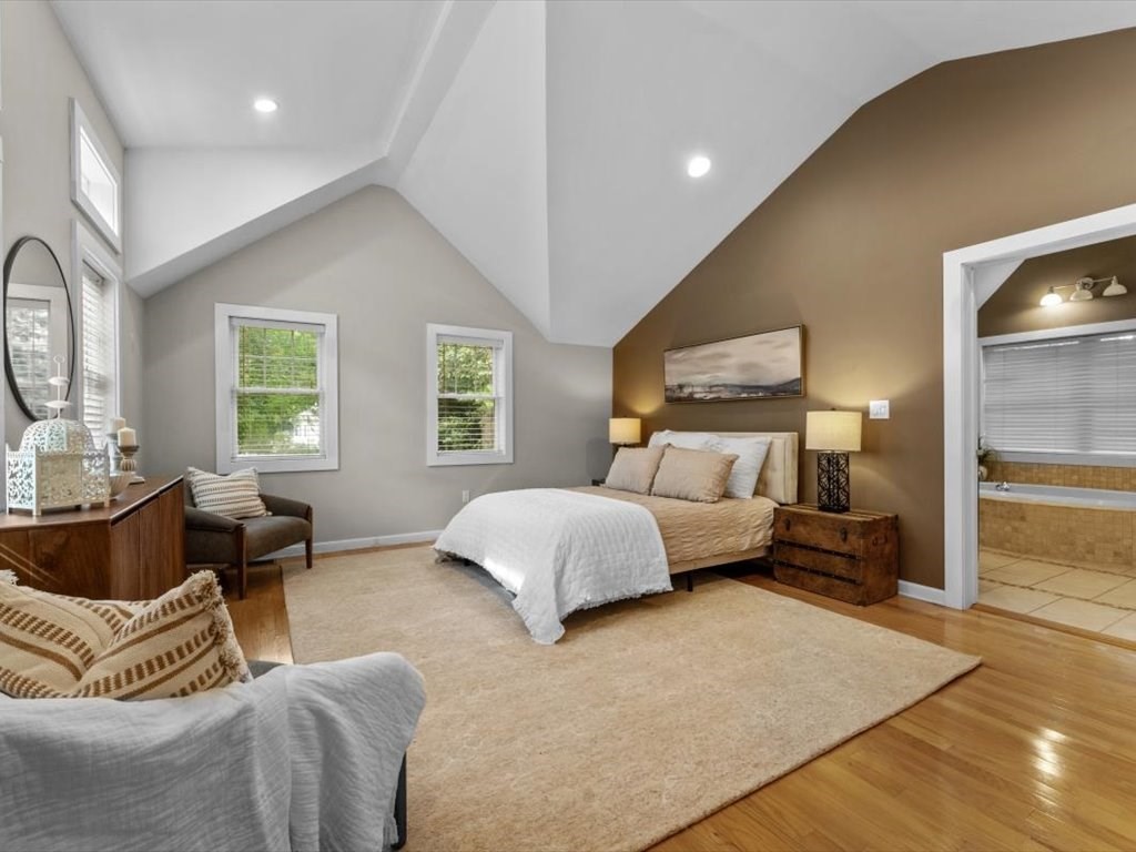 39 Evergreen Road Natick, MA 01760 - Photo 18 of 36 a bedroom with a bed and wooden floor