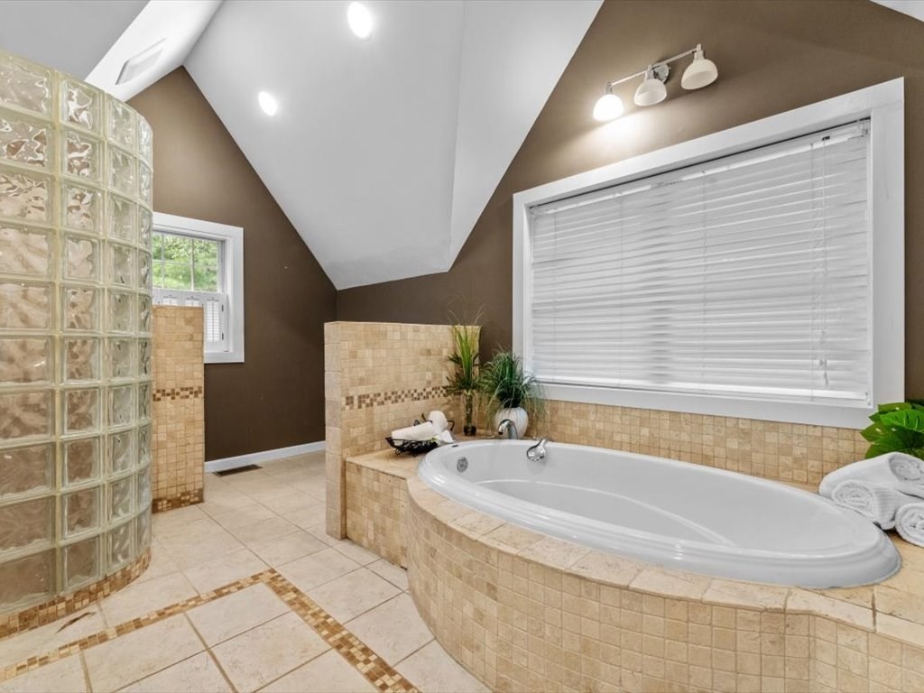 39 Evergreen Road Natick, MA 01760 - Photo 22 of 36 a bath tub sitting in a bathroom next to a window