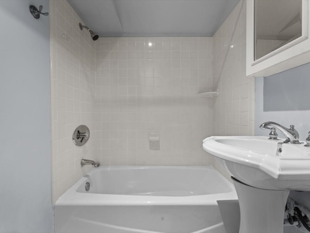 39 Evergreen Road Natick, MA 01760 - Photo 28 of 36 a bathroom with a sink and a bathtub