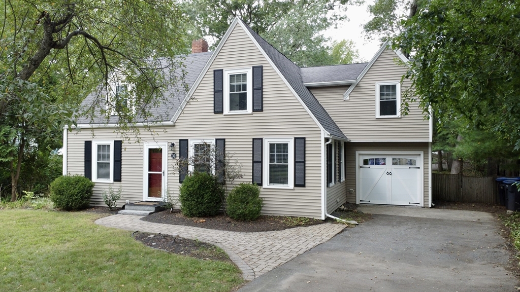 39 Evergreen Road Natick, MA 01760 - Photo 33 of 36 a view of a house with a yard and plants