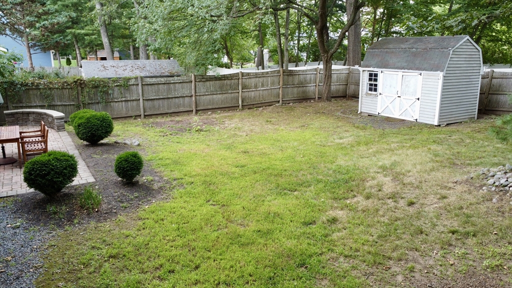 39 Evergreen Road Natick, MA 01760 - Photo 36 of 36 a backyard of a house with lots of green space
