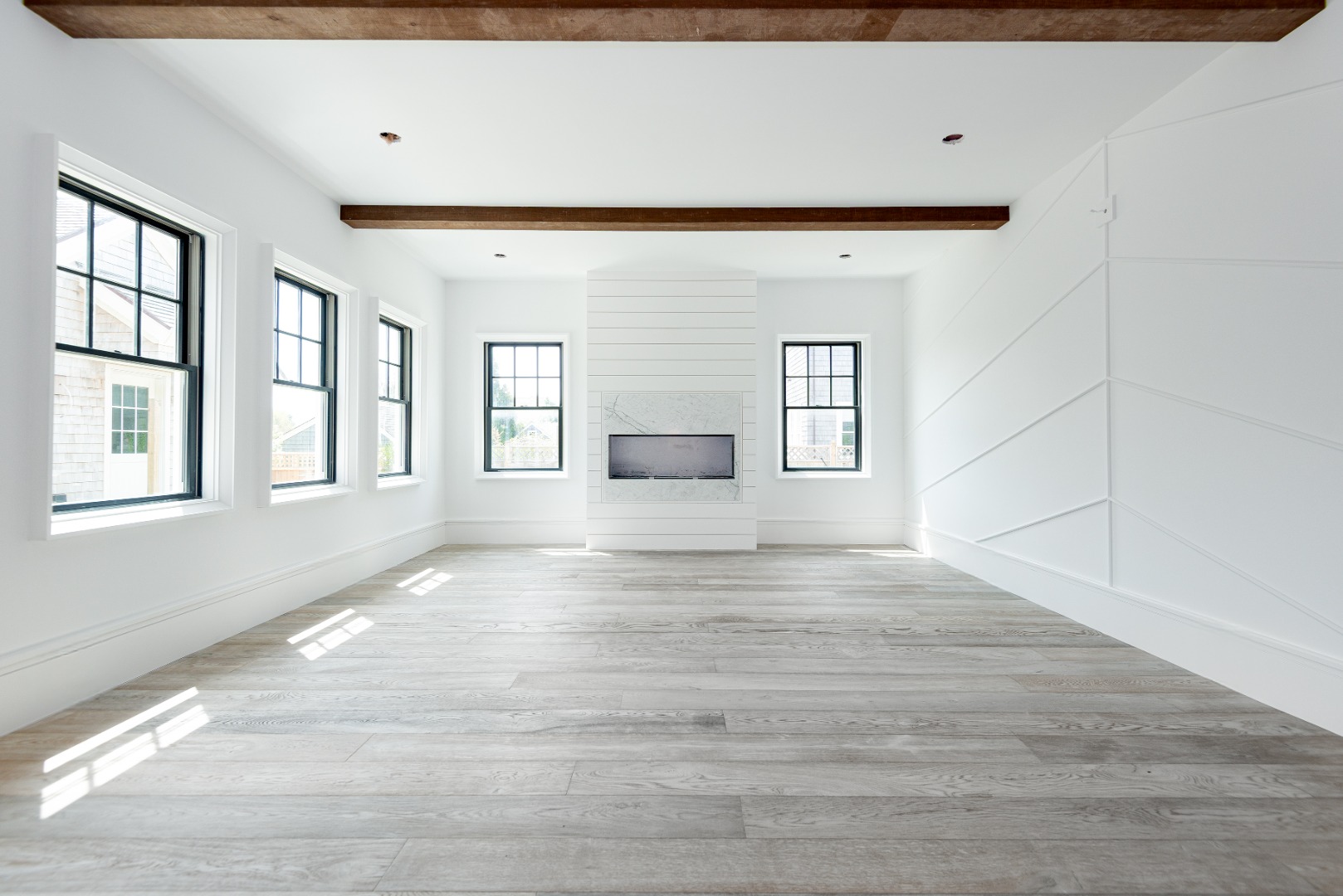 84 Cliff Road Nantucket, MA 02554 - Photo 6 of 12 a view of empty room with wooden floor and fan
