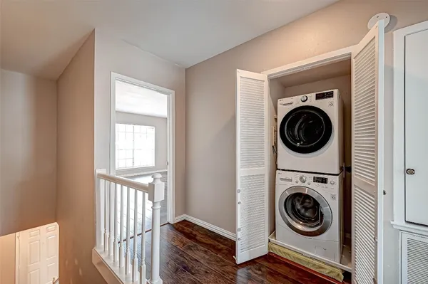 a view of a hallway with washer and dryer