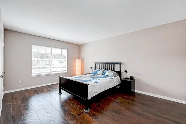 a bedroom with a bed and window