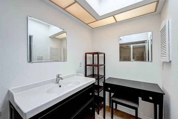 a view of a workspace room with a table and chairs