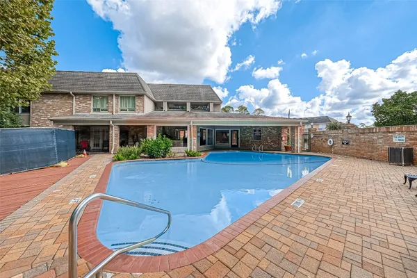 a view of a house with swimming pool